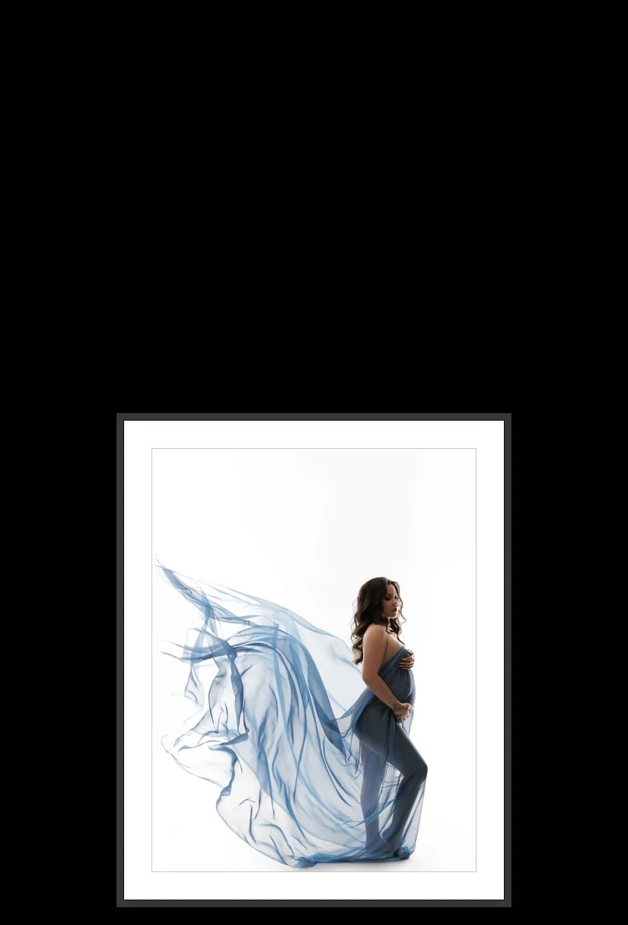 A 16×20 print in a black frame, beside the other sizes at the size it really is
